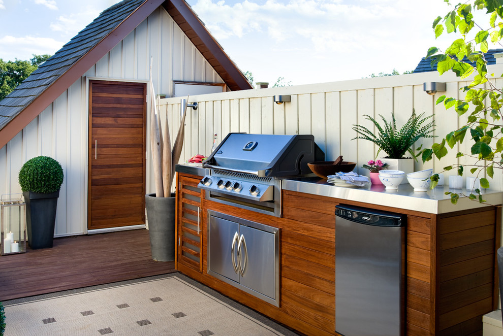 This rooftop kitchen features even a dishwasher. A  subtle lighting system make it a great space for some night entertaining.