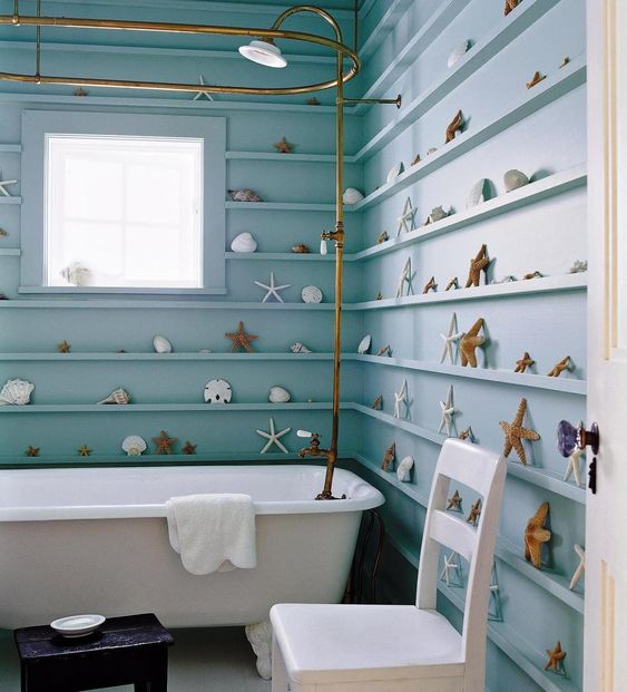 a beach-inspired bathroom with ledges for displaying starfish, seashells and other items that create a chic look