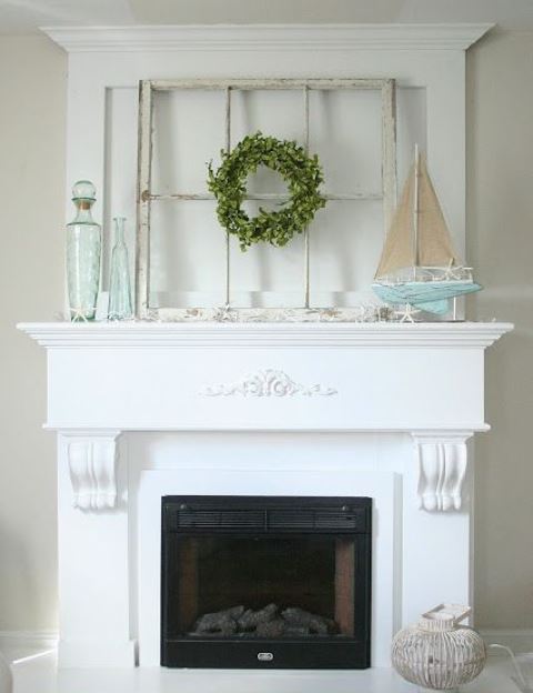a beach mantel with a window frame, a blue boat with starfish, aqua bottles and starfish looks relaxed