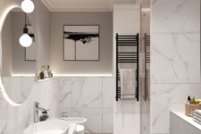 a chic contemporary bathroom with white marble, sleek wood, a patterned floor and touches of black