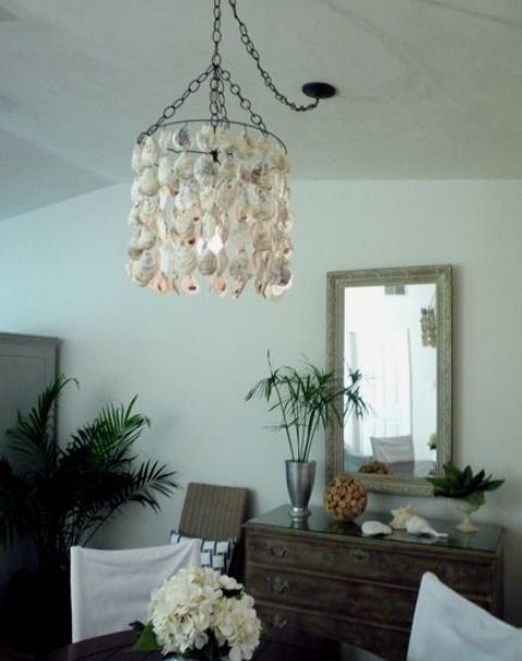 a creative seashell chandelier for a beachy boho space looks cool and chic and can be easily DIYed