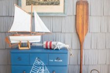 a handpainted maritime dresser is a lovely idea for a coastal or beachy space and can be easily DIYed