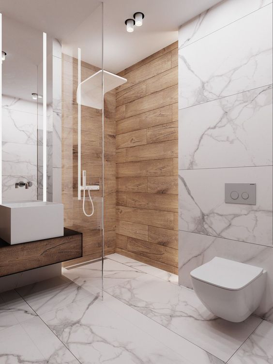 a minimalist bathroom with white marble, a floating wooden vanity and natural wooden planks in the shower