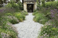 a simple and natural white pebble pathway will fit many garden styles