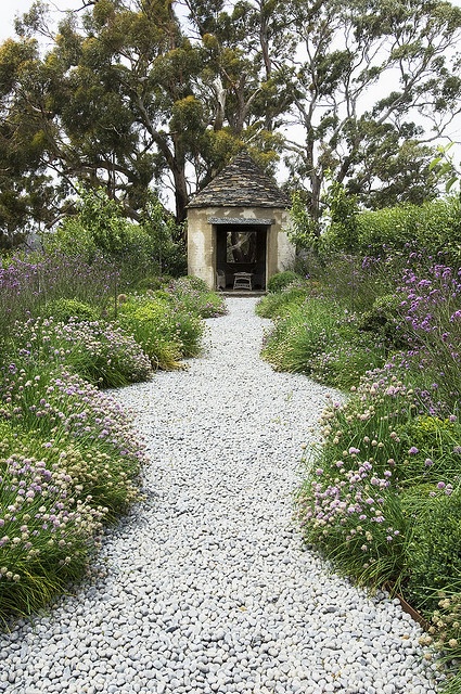 a simple and natural white pebble pathway will fit many garden styles