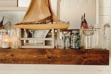a cool summer mantel decor with a boat