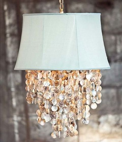 an aqua pendant lamp with seashells is a lovely idea for a coastal or seaside space, looks very unusual