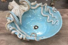 an octopus sink in blue will catch an eye in your bathroom or powder room and will make it unforgettable