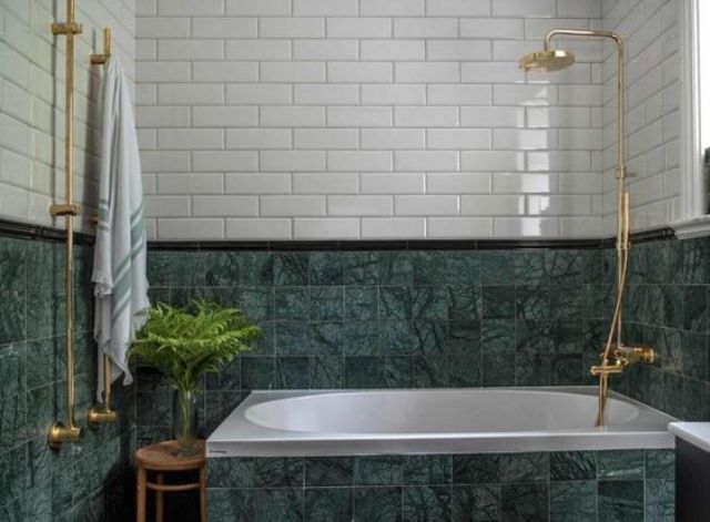 green marble tiles plus white ones and gold hardware for a bold contrasting look in the bathroom