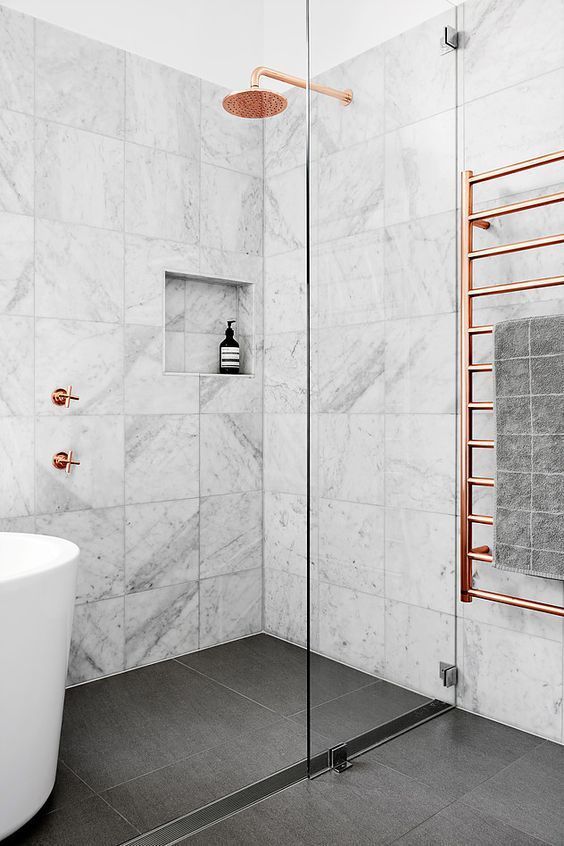 play with contrasts rocking white marble tiles, black ones on the floor and psrucing them up with copper