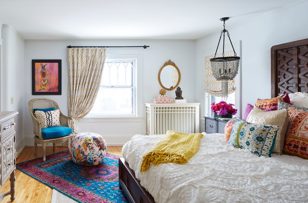 Bold colorful rug and a gorgeous pendant light fixture are a great company to other vintage pieces in the room.