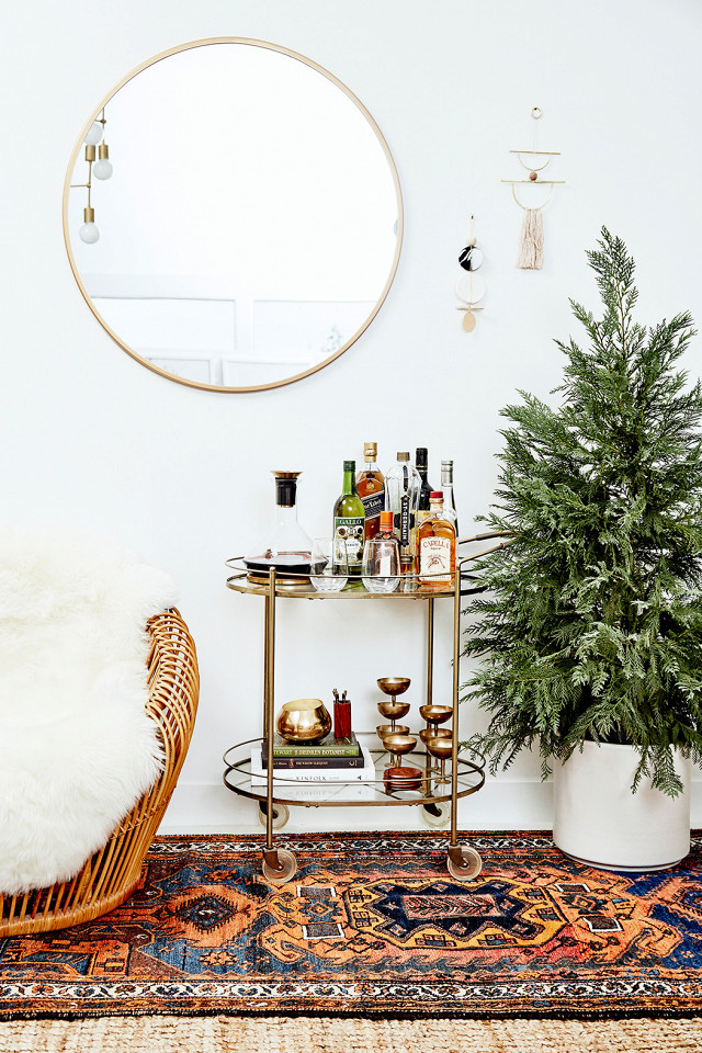 Adding a small bar cart is a great way to spruce up a bohemian living room.