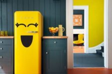 a hunter green kitchen with a bold yellow Smeg fridge looks extra bold and fun, it’s pure modern chic