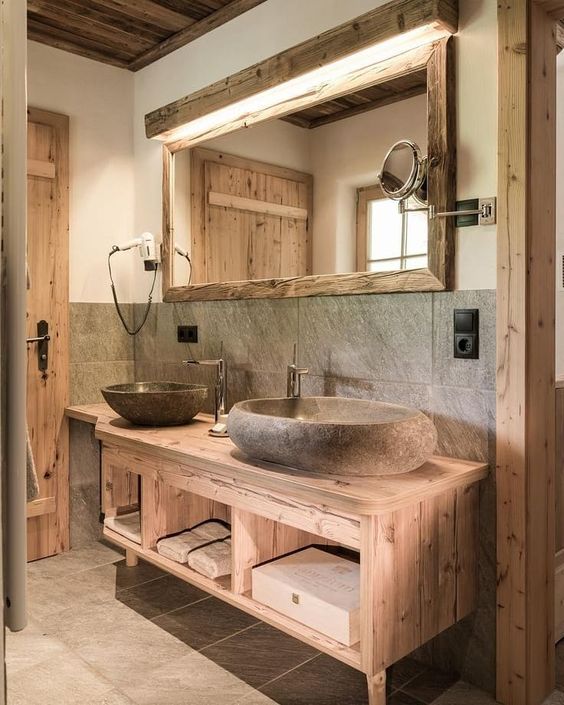 a natural looking bathroom with much wood, stone and tiles for a cozy feel