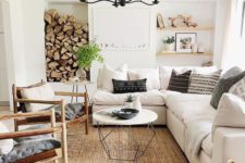 a rustic living room with a jute rug, a firewood storage, comfy furniture and a basket with firewood
