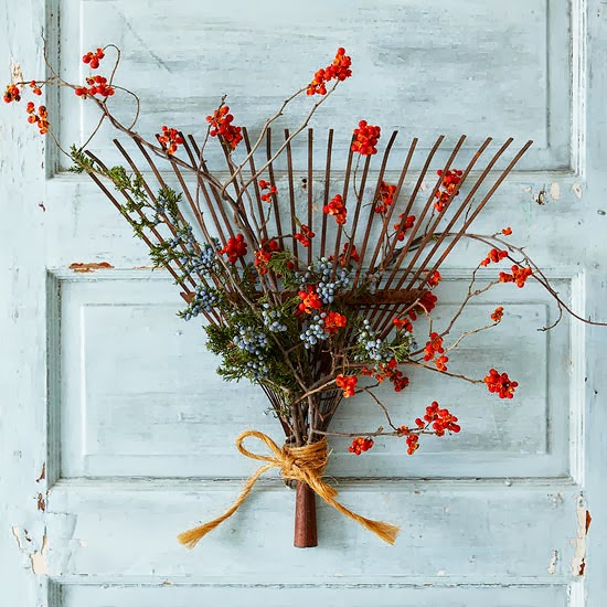 Repurpose old rakes and make them by adding twigs with dried berries.