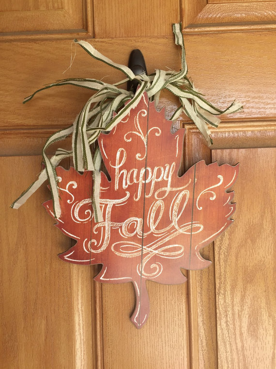 Rustic fall leaf door hanger could be made from a single piece of wood.