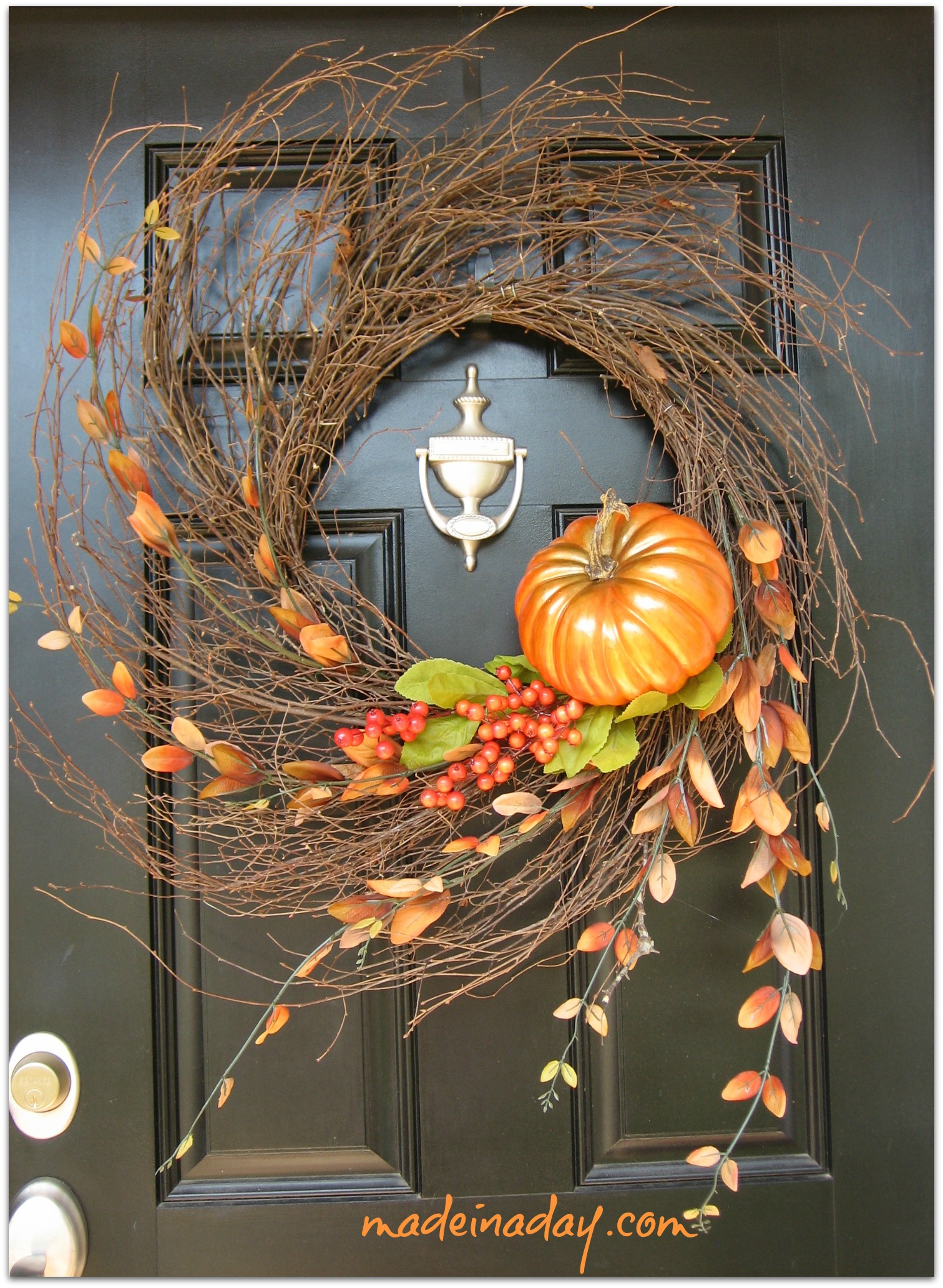 Add a glittered pumpkin to a twig wreath to make your front door shine.