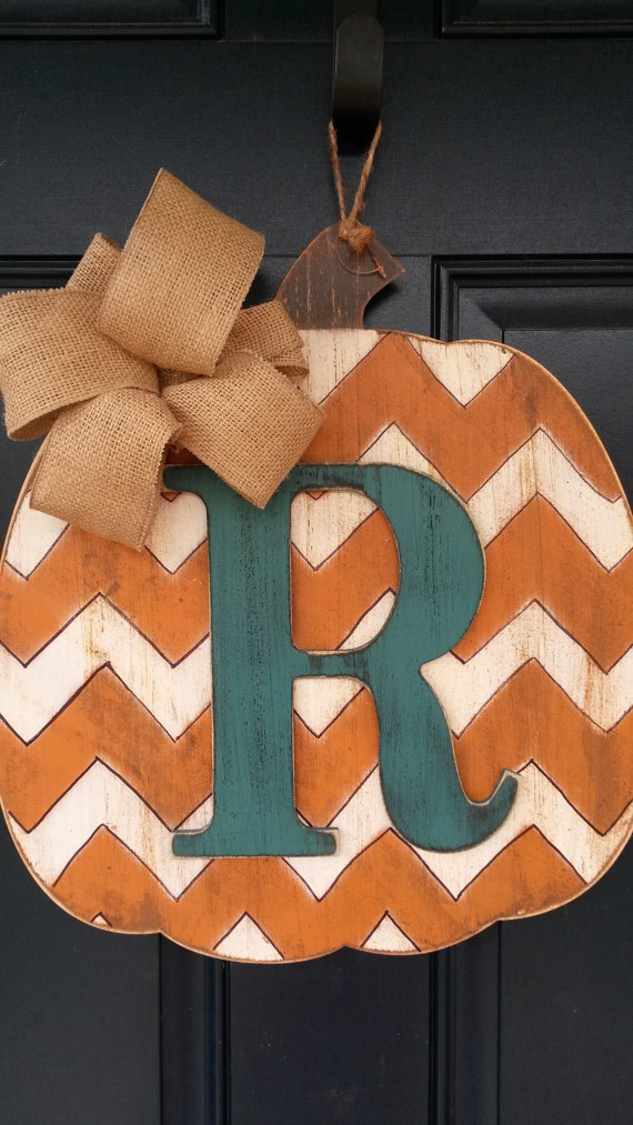 Make a faux monogrammed pumpkin from a wood board.