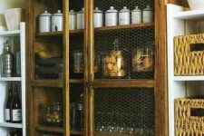 a kitchen buffet with chicken wire doors is nice for storign everything you want including food in jars