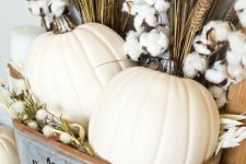 a lovely fall decoration of a tin bathtub with white pumpkins, cotton branches, wheat and dried blooms will bring a rustic feel to the space