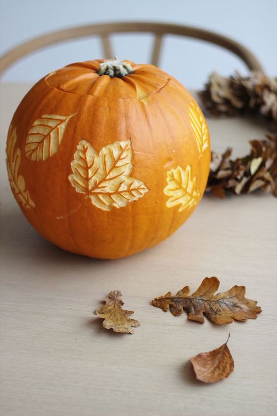 A pumpkin with carved leaves is a beautiful all natural fall decoration you can make yourself