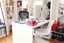 a vivacious feminine home office with an open storage unit, a desk, some chairs and a zebra rug plus bright pink touches