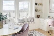 an airy neutral home office with lilac chairs, a printed rug, a windowsill daybed and storage units