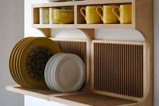an elegant wooden shelf for storing plates and mugs and cups at the same time is perfect for a modern kitchen