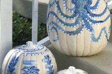 coastal pumpkins in white and blues – with various painted motifs – are great for fall coastal decor, outdoors and indoors