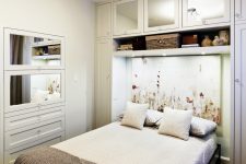 perfect small bedroom design where the bed has a cozy built-in feel, thanks to the recess created by the shelving