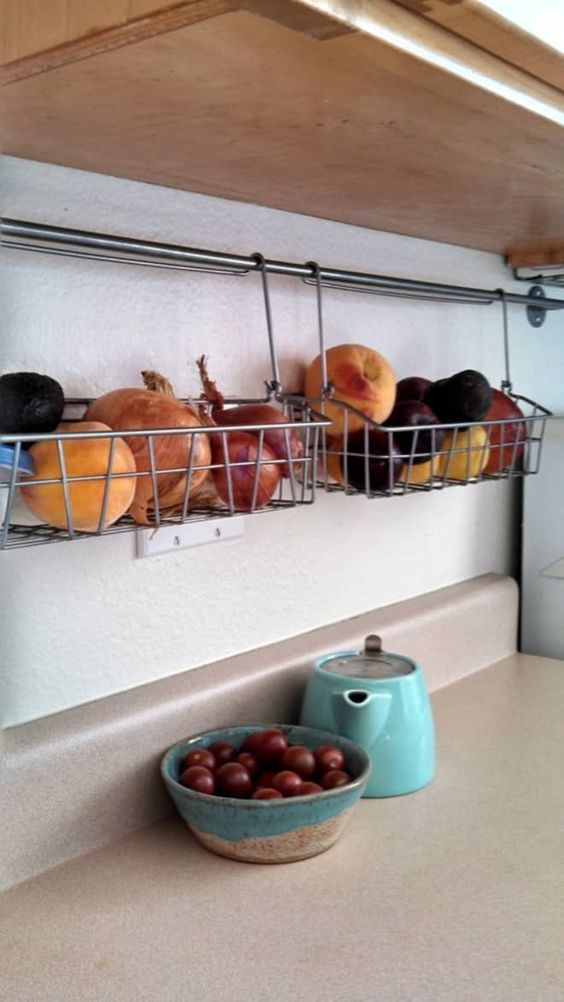 railing with wire boxes that can store anything, from food to mugs and plates