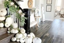 styling the staircase with white pumpkins, greenery and fresh white blooms is very refined and gorgeous