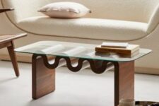 a catchy modern coffee table with a glass tabletop and a wooden table base is a stylish solution for a modern living room