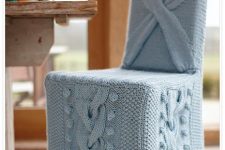 a chair covered with powder blue knit is very chic and cool and will finish off a vintage or rustic space