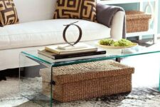 a clear glass table with a large woven box with a lid under it, it can be used for storage without cluttering