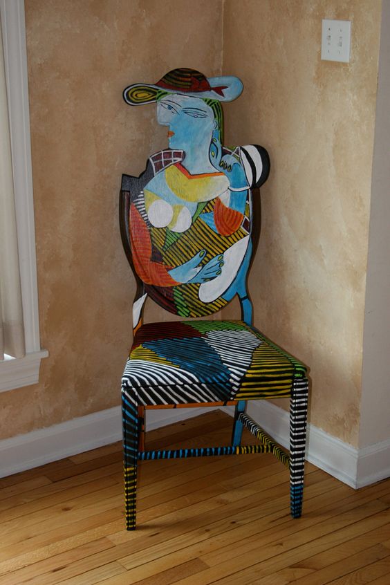 a colorful chair inspired by Picasso paintings is a great idea for an art-lover space