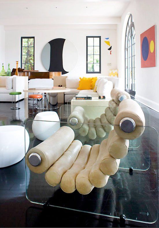 a cool modern chair with acrylic stands an creamy leather tbes is a cool idea for a modern space, this is eye-catchy