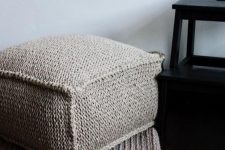 a cozy grey crocheted ottoman is a cool piece to make your space winter-ready