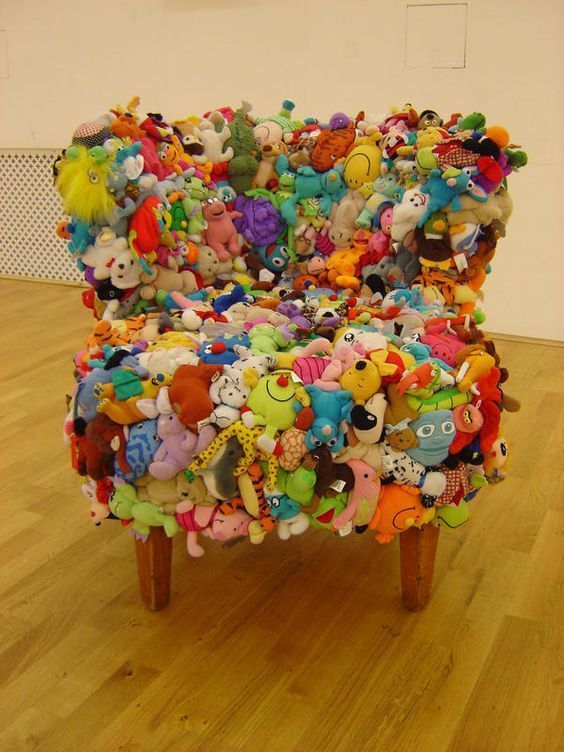 a creative and colorful chair composed of plush toys will be a gorgeous idea for a kids' room or a space where youw ant something whimsical