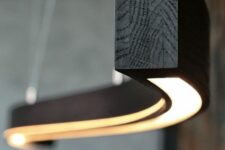 a curved dark wodo pendant lamp is a fantastic solution for a modern, contemporary or industrial space, it looks unusual