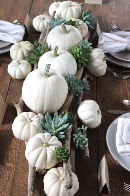 a fall centerpiece with branches, white pumpkins and succulents is easy to make