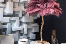 a fun ostrich feather table lamp with a base reminding of an ostrich leg is a glam and quirky idea to go for