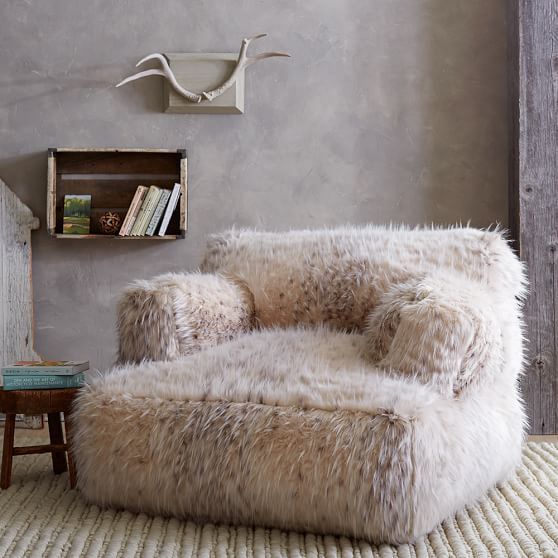 a fuzzy faux fur oversized chair or lounger is amazing to relax in it after a long day