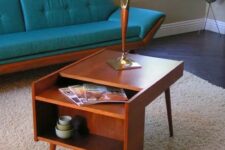 a lovely rich-stained mid-century modern coffee table with open storage compartments is a good idea for a nightstand, too