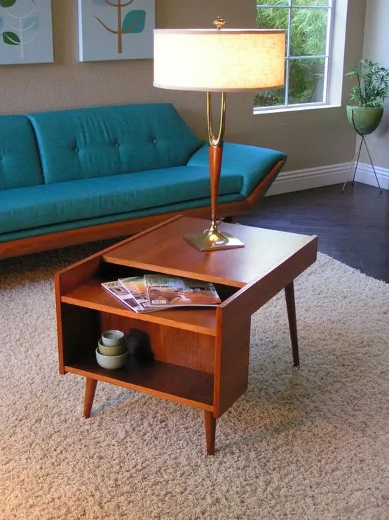 A lovely rich stained mid century modern coffee table with open storage compartments is a good idea for a nightstand, too