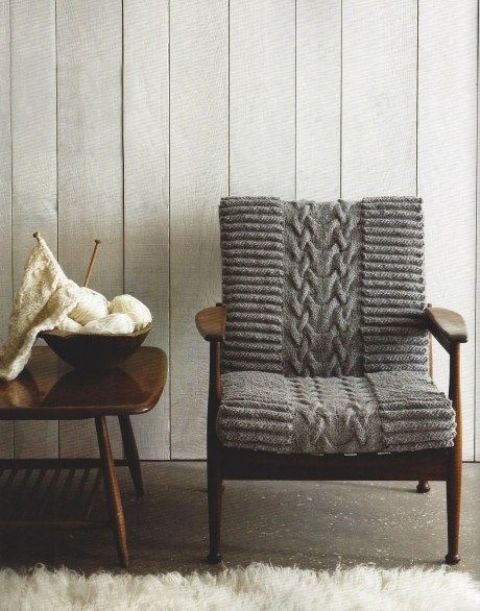 a mid-century modern chair finished off with cozy grey knit is a lovely idea to make your space welcoming