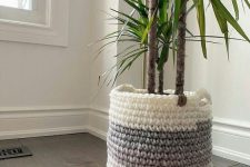 a planter covered with an ombre chunky crochet piece with handles is a great idea to rock for the fall or winter