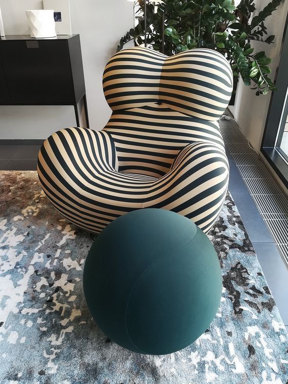 A sofa inspired striped chair like this one is created for ultimate relaxation and will add a touch of fun to your space