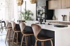 a stylish black and white contemporary kitchen with jaw-dropping gold scale pendant lamps is jaw-dropping